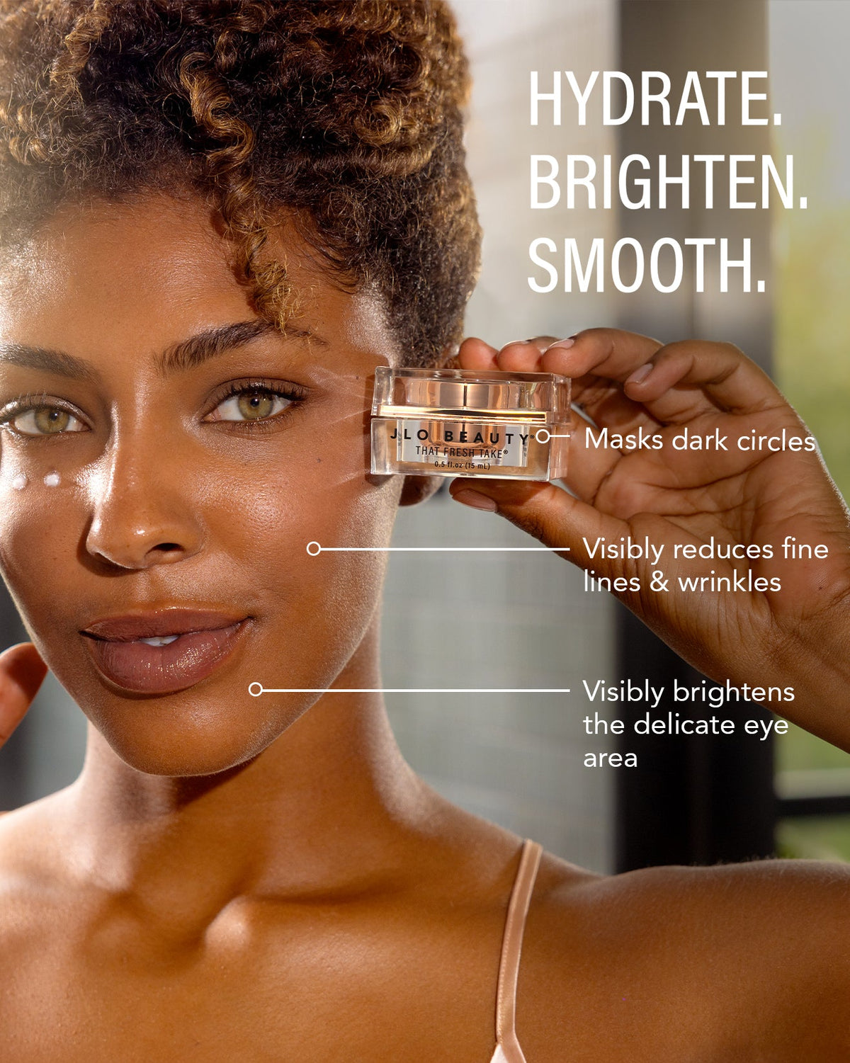 Model with radiant under-eye skin beside Eye Cream benefit copy.