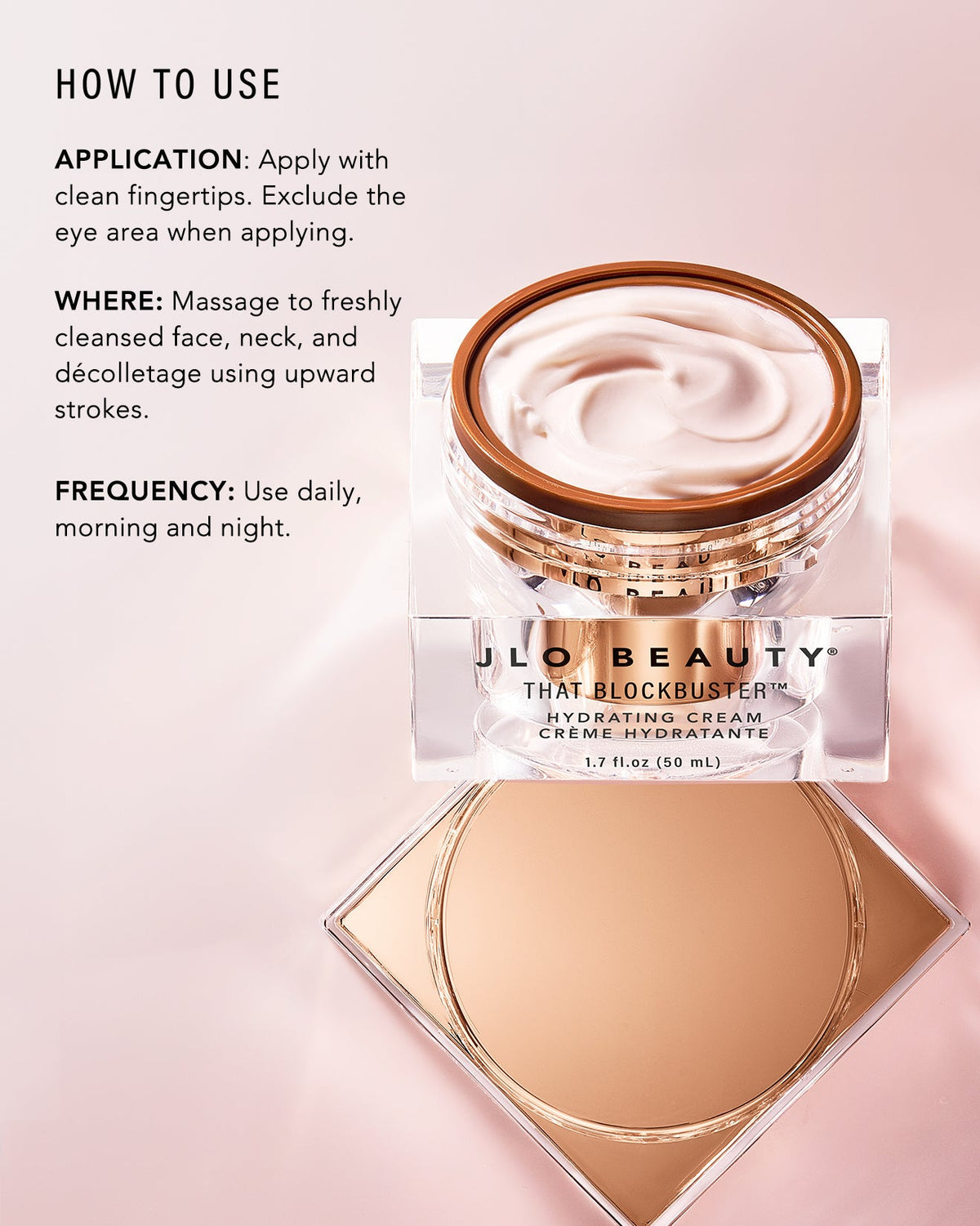 JLO Beauty That Blockbuster Hydrating Cream jar shown with its lid placed below on a pink background, alongside a text panel explaining how to use the cream.