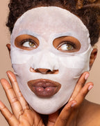 A picture of a model wearing a JLO Beauty face mask.