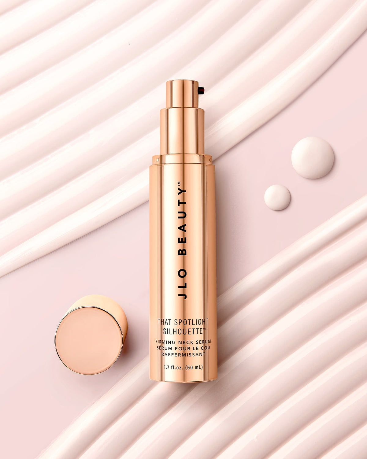 JLO Beauty That Spotlight Silhouette Firming Neck Tube with product droplets