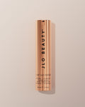 JLO Beauty That JLO Fusion Retinal + Vitamin C Power Serum in a sleek, metallic rose gold cylindrical bottle