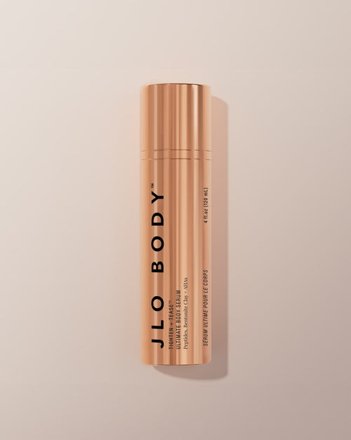JLO BODY Ultimate Body Serum in a sleek metallic rose gold cylindrical bottle
