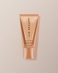 JLO Beauty Cleanser tube on a neutral background.