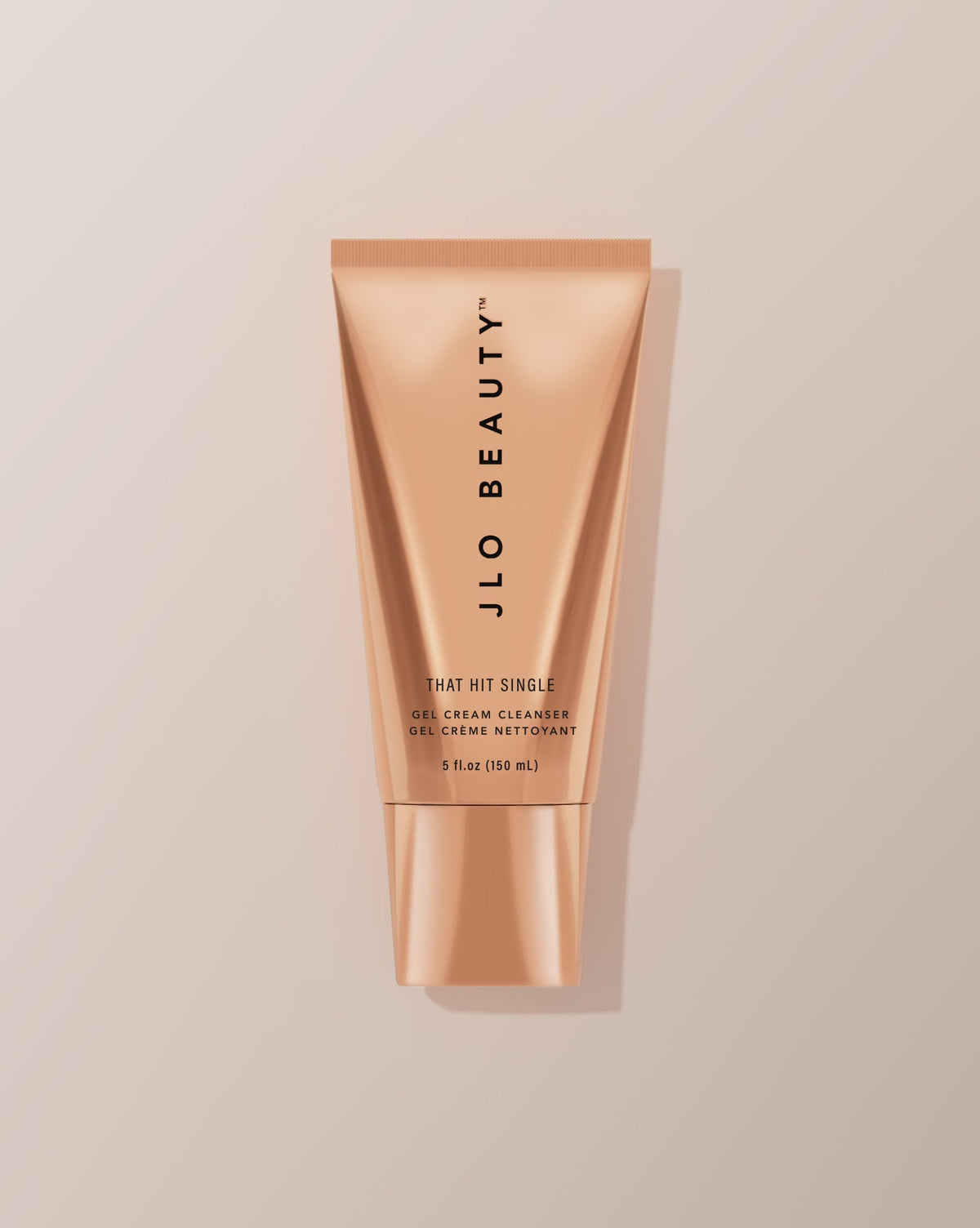 JLO Beauty Cleanser tube on a neutral background.