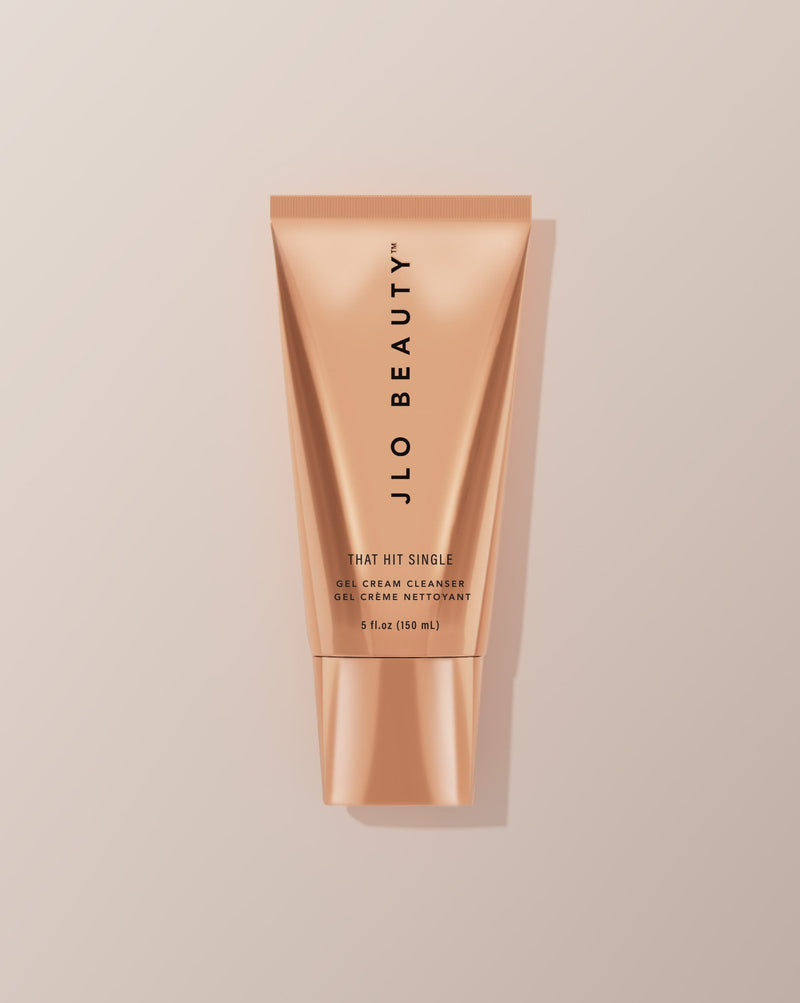 JLO Beauty Cleanser tube on a neutral background.