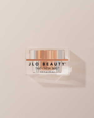JLO Beauty Eye Cream jar on a neutral background.