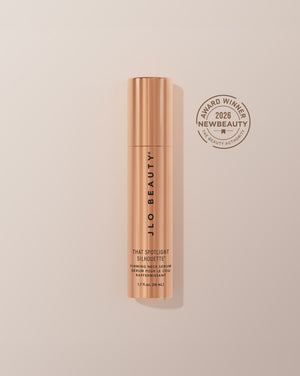 JLO Beauty That Spotlight Silhouette Retinol Night Cream in a metallic rose gold tube with a bronze award badge on the right reading '2026 New Beauty Award Winner'.