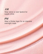 A close-up cosmetic texture shot of a glossy peach-pink lip product with overlaid text reading 'AM Wear alone or over lipstick for supple shine' and 'PM Wear a thicker layer for an intensive overnight mask.'.