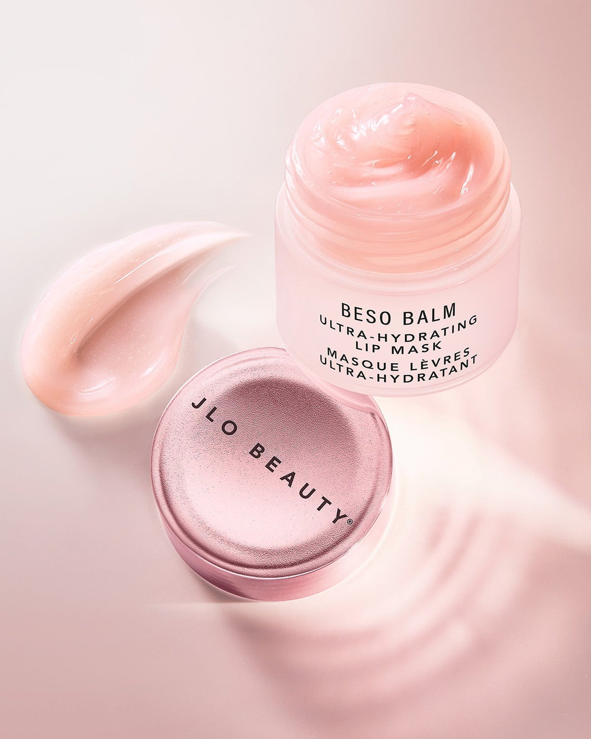 JLO Beauty Beso Balm ultra-hydrating lip mask in a frosted pink jar 